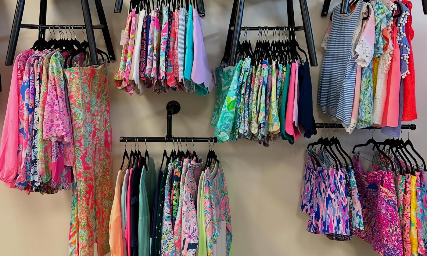 Lilly Pulitzer clothes hanging on racks