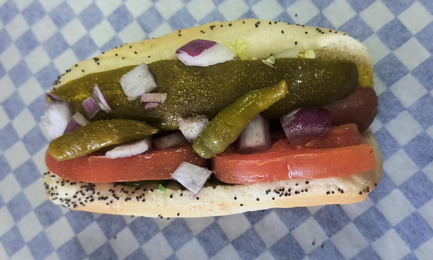 A Chicago-style hot dog with assorted toppings