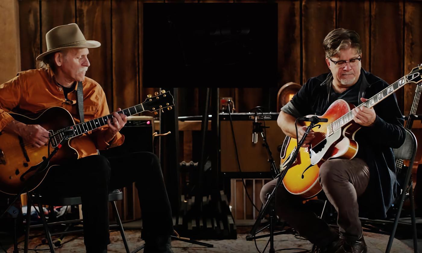 Bruce Forman and Pat Bergeson on stage playing guitars