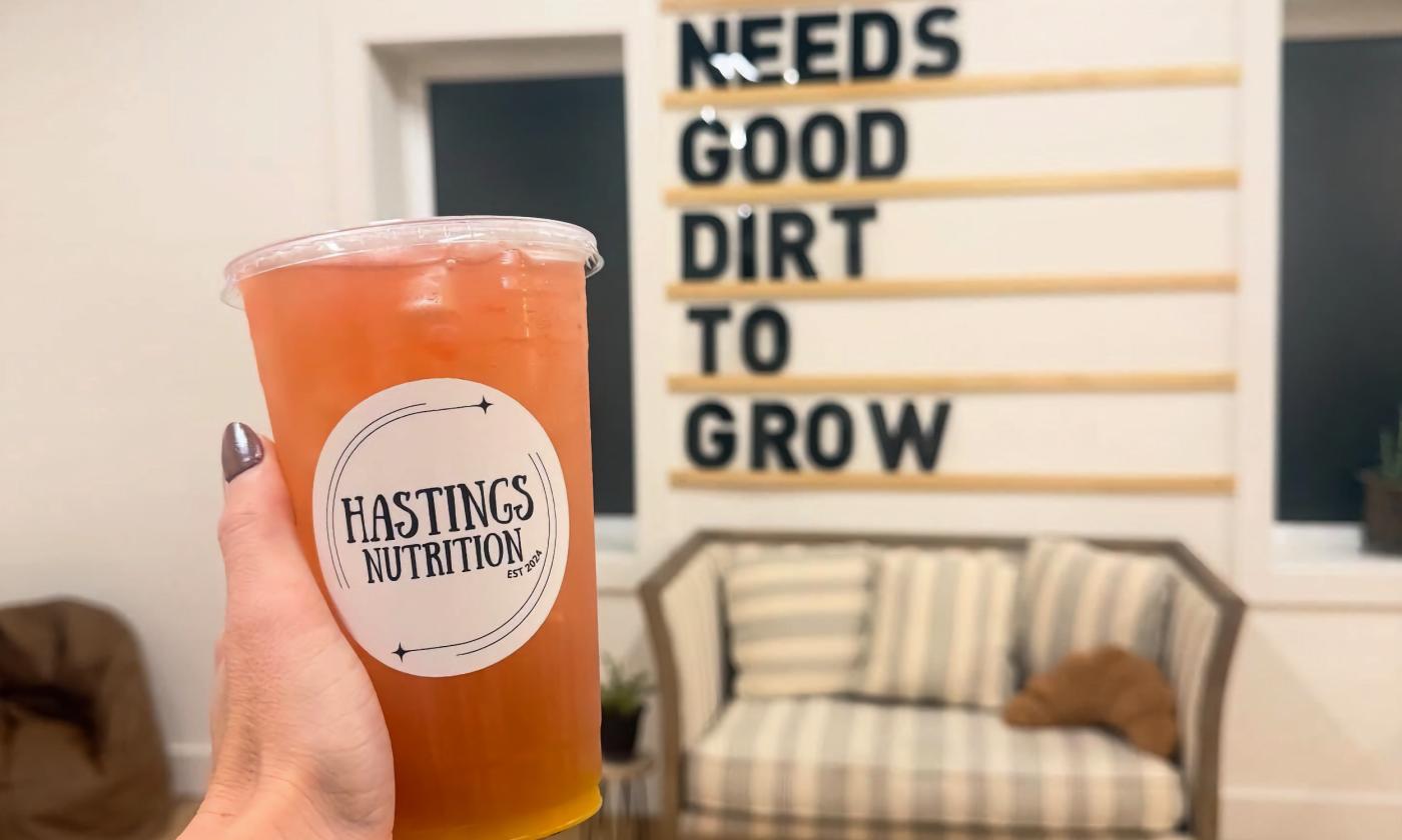 A energy tea drink being held up