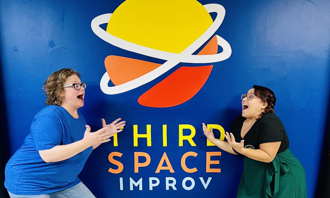 Two improvisers playing together at Third Space Improv.
