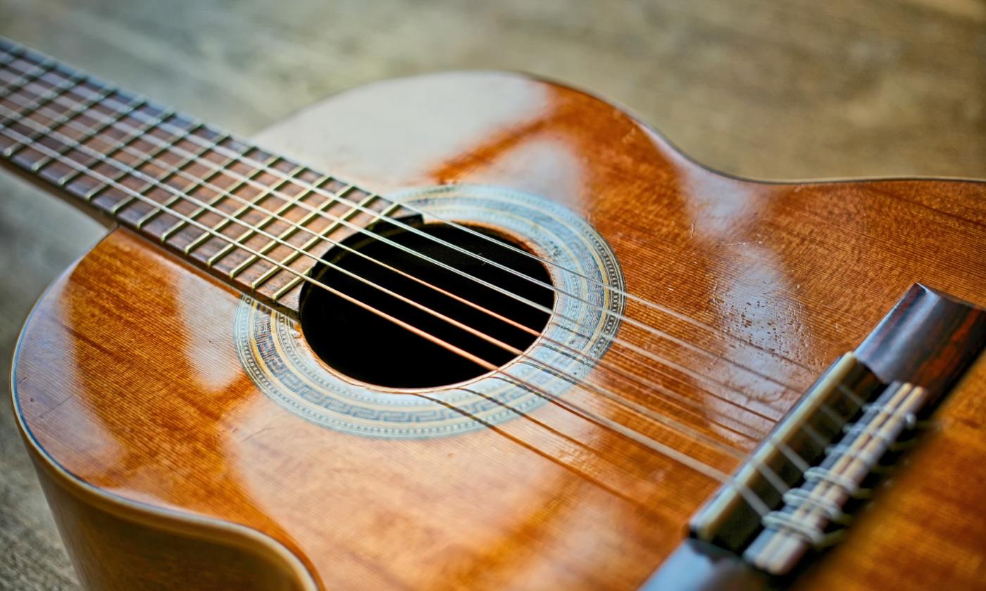 A highly polished classical guitar in the sunlight