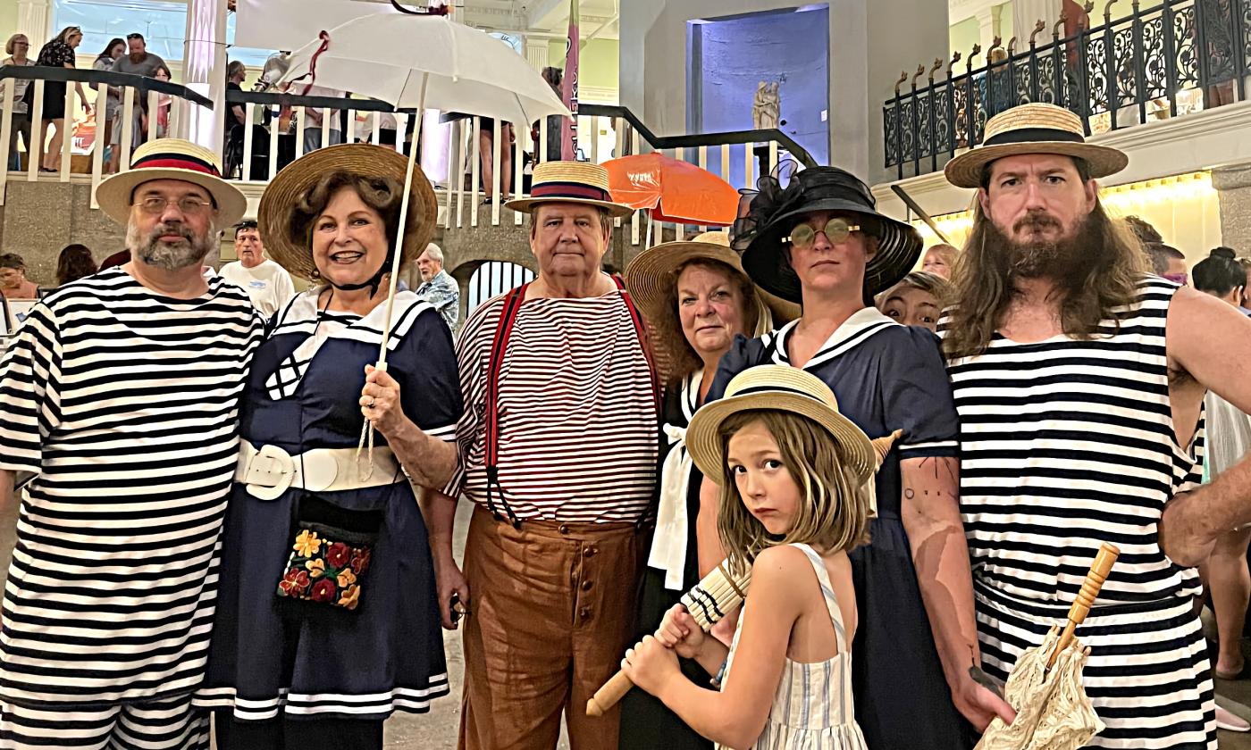 Models dressed in swimwear from the late 1800s