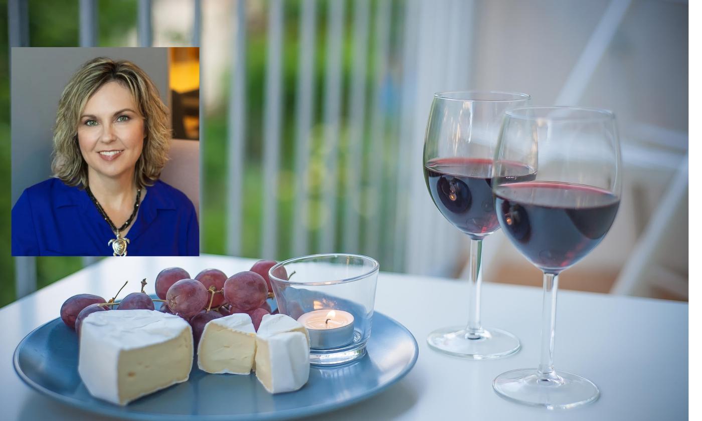 A display of wine and cheese, with an author inset in the upper left