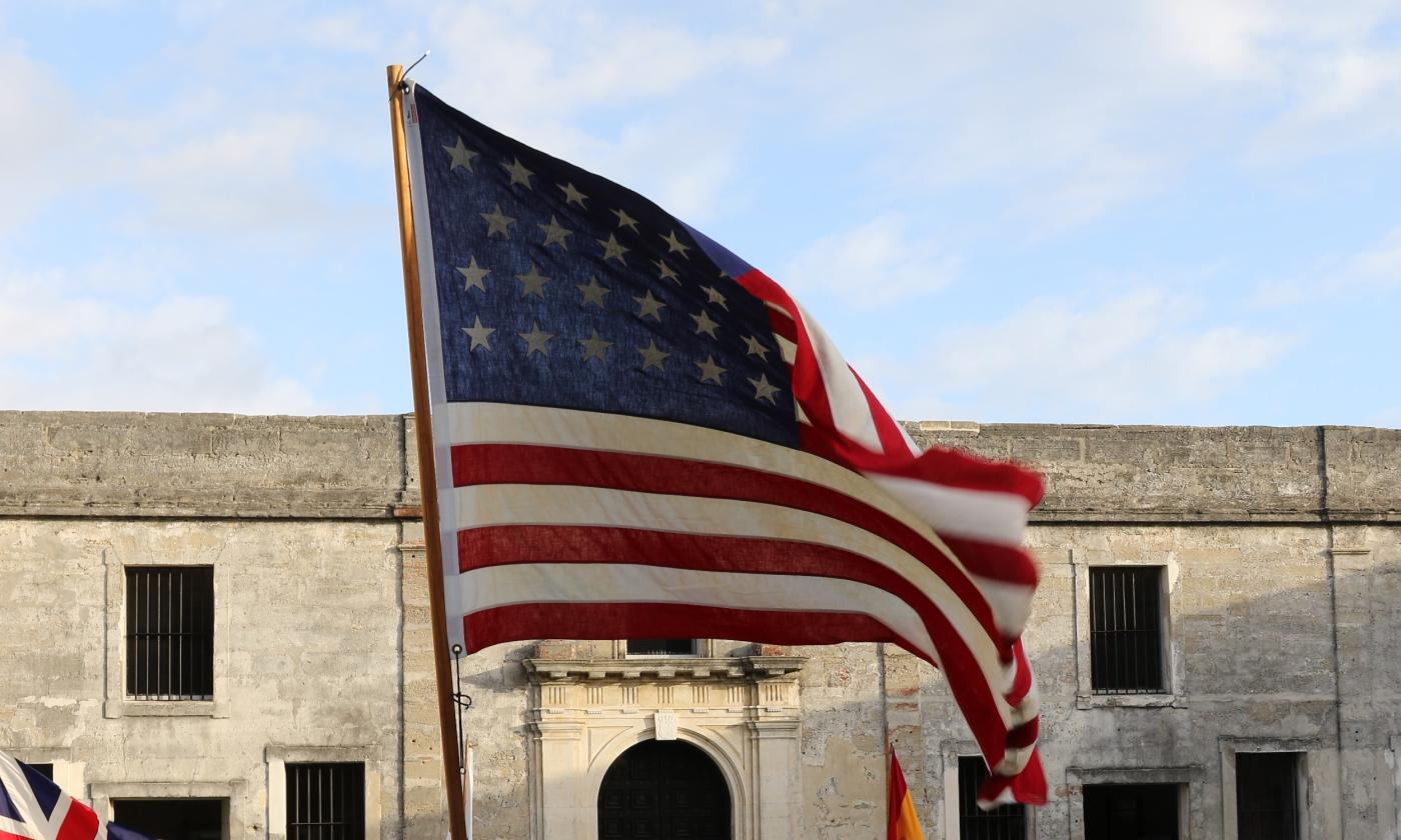 An American Flag waving inside the grounds of the Castillo de San Marcos