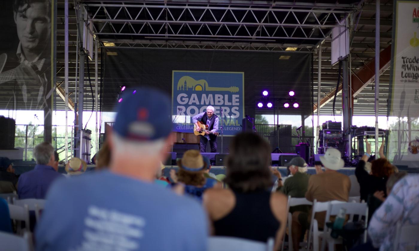 A wide photo of the stage at Gamble Rogers with Verlon Thompson