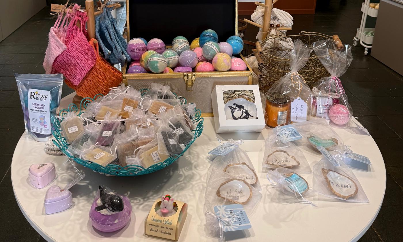 A table filled with various soaps and trinkets