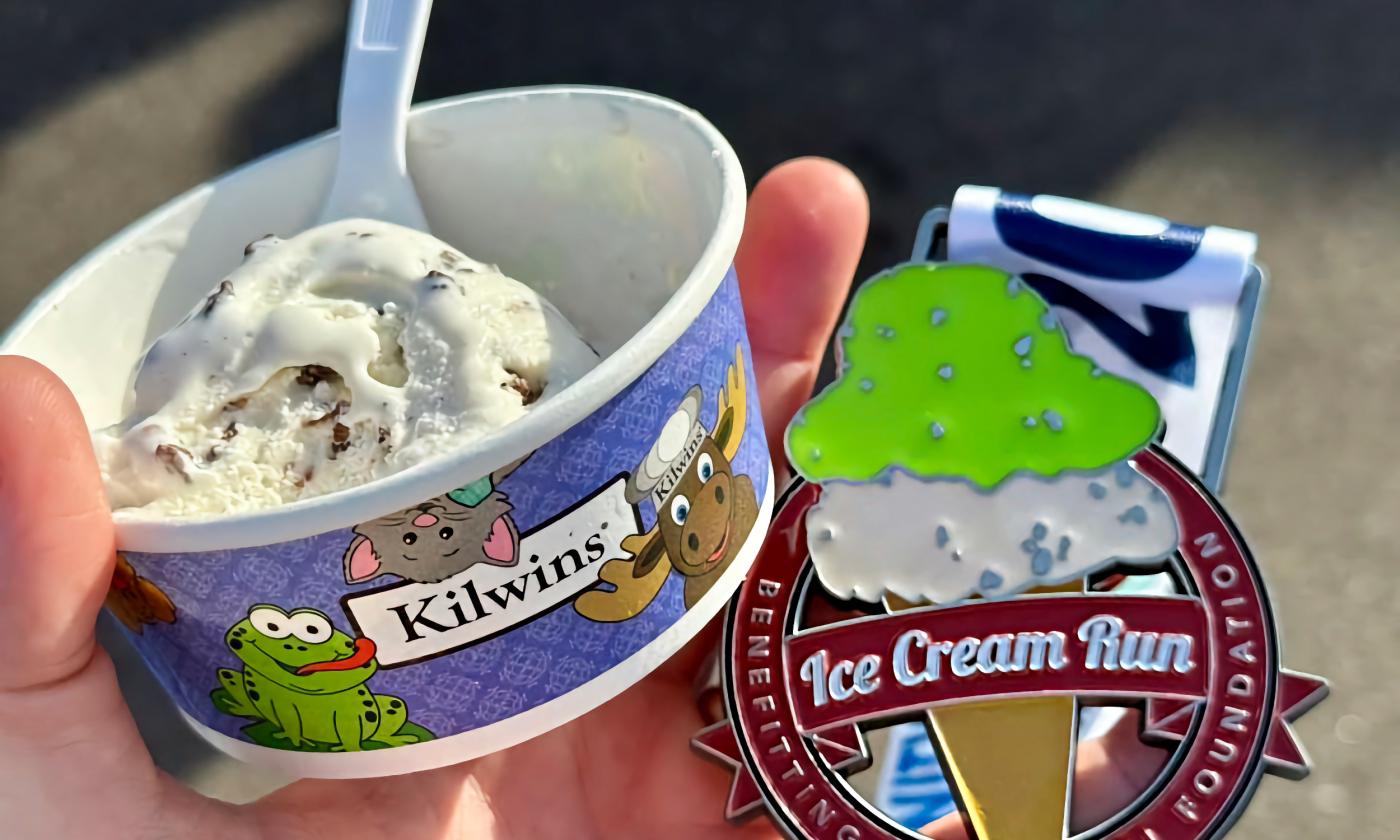 A cup of Kilwins Ice Cream and a finisher medal for the 5K Run
