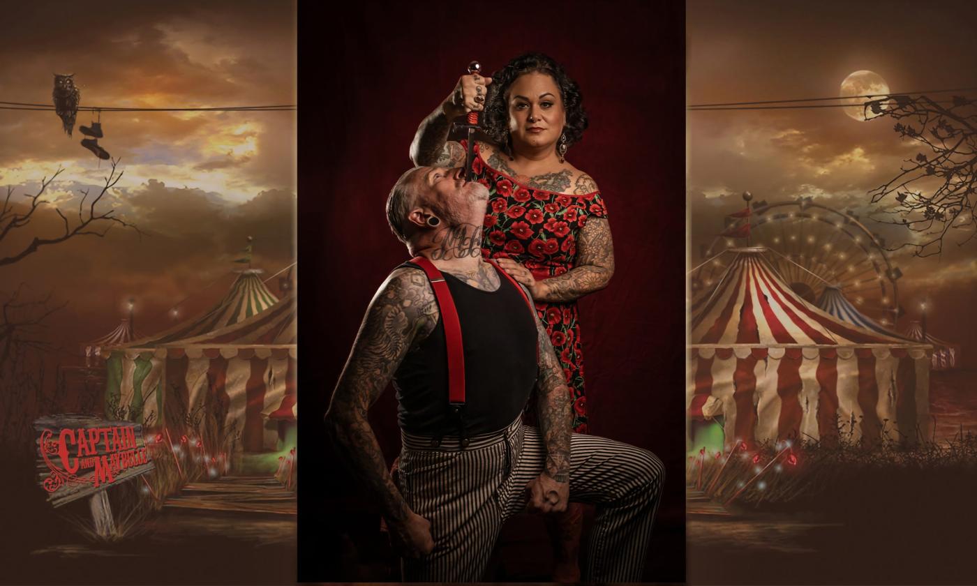 The Captain and Maybelle performing a sword-swallowing trick