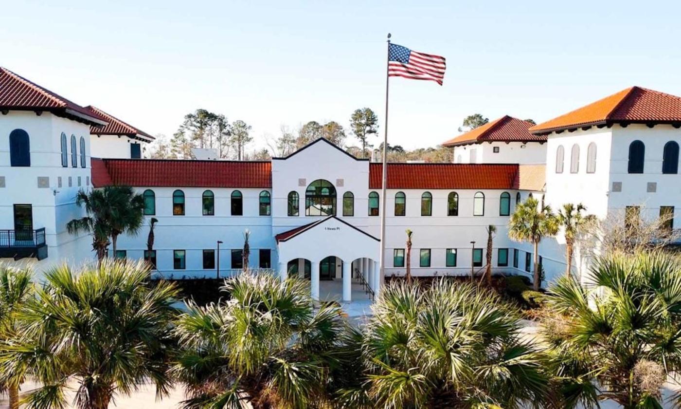 A white building with a flag