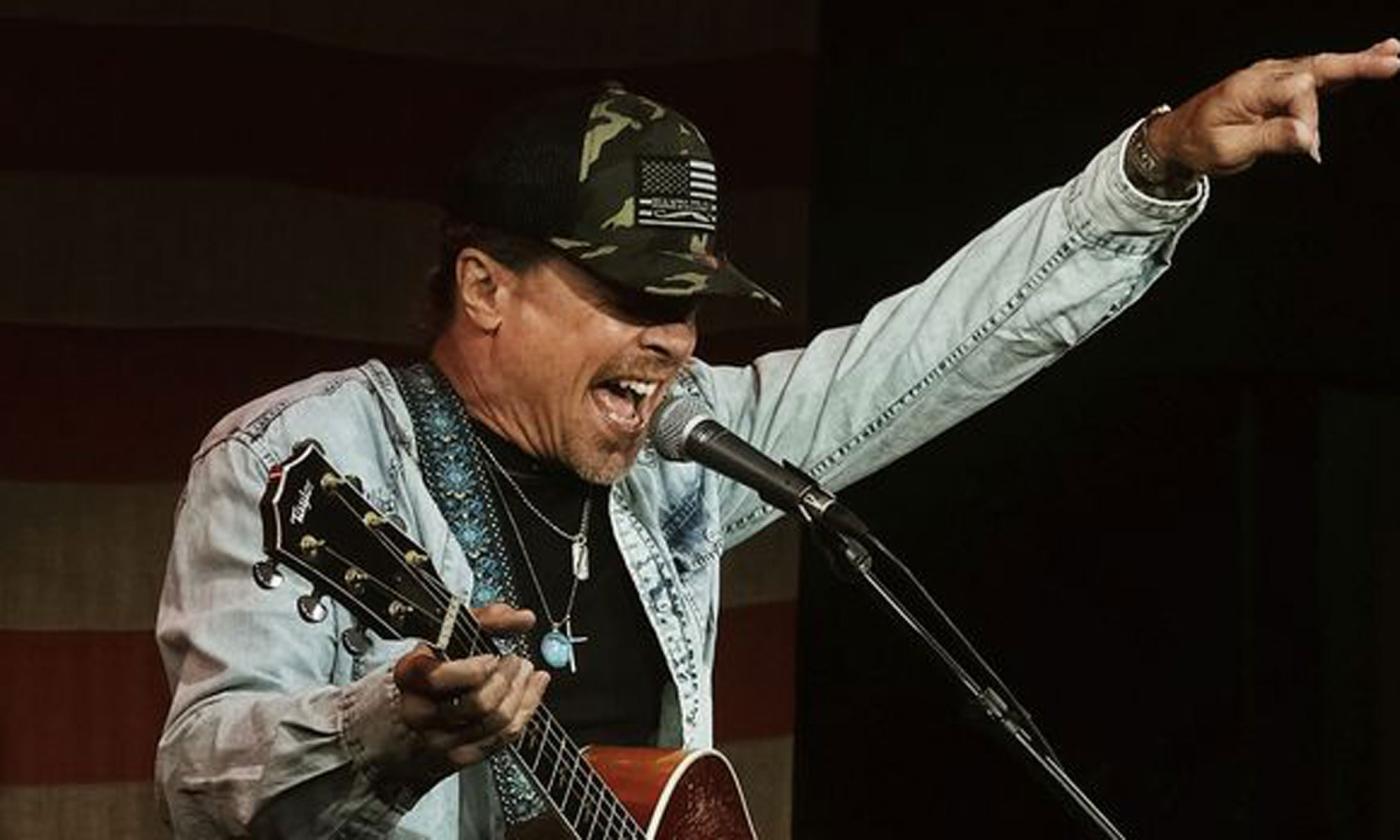 songwriter Jeffrey Steele onstage, singing