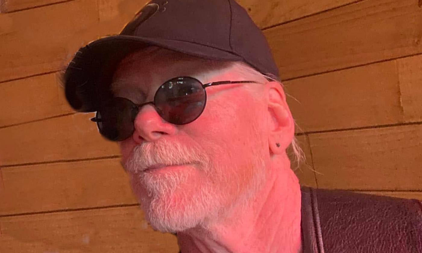 headshot of bassist Rusty Springfield in sunglasses and hat