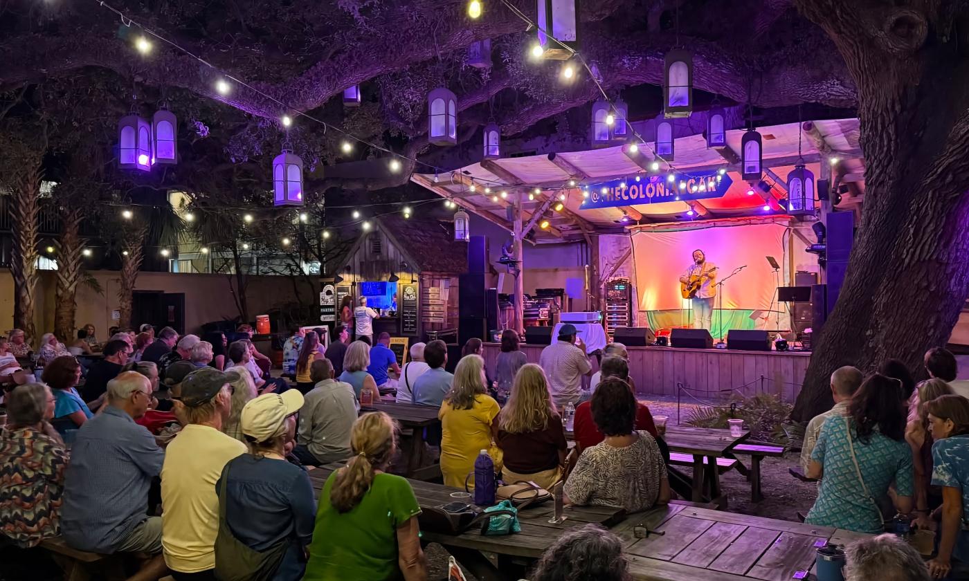 The audience and stage at the 2025 Pecha Kucha Sing Out Loud event