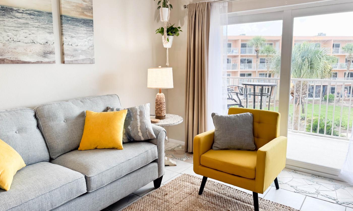 The patio doors offer a view and bring sunshine into the condo