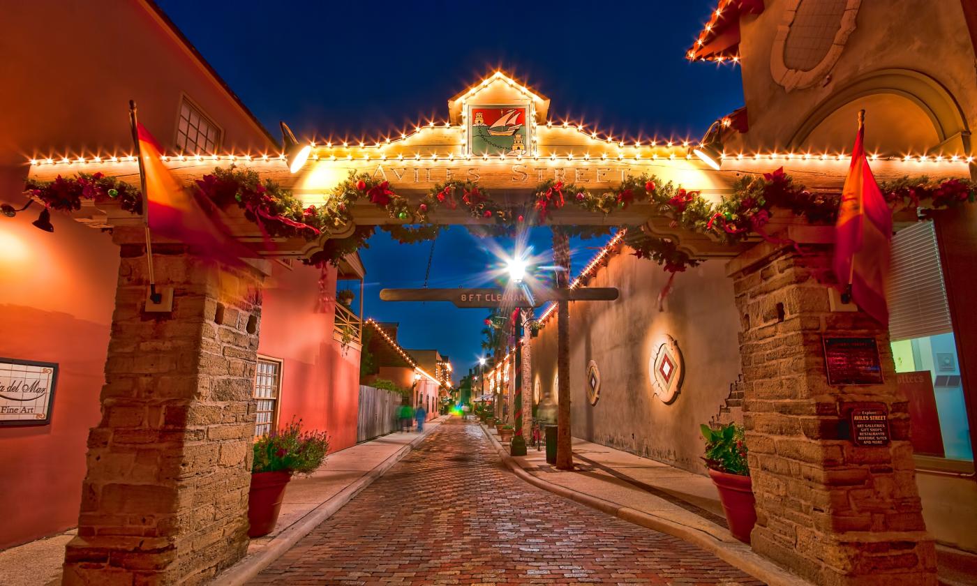 The arch at the entrance to Aviles Street, decorated for the season