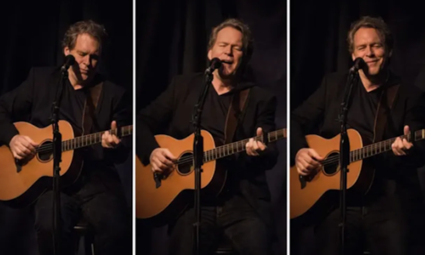 Tom Glynn performs live on stage.