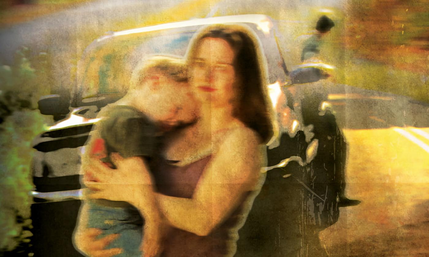 Amy McGee holding her child in the film poster