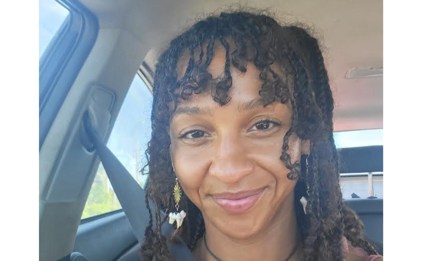 Songwriter Miryam Harbour headshot, in a car