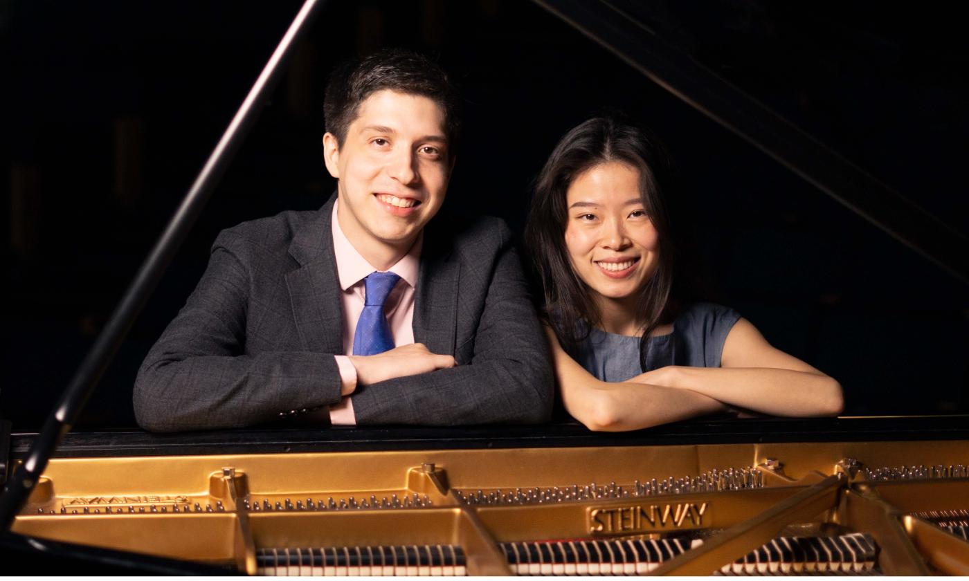 Echo Duo, two pianists, sitting at a Steinway