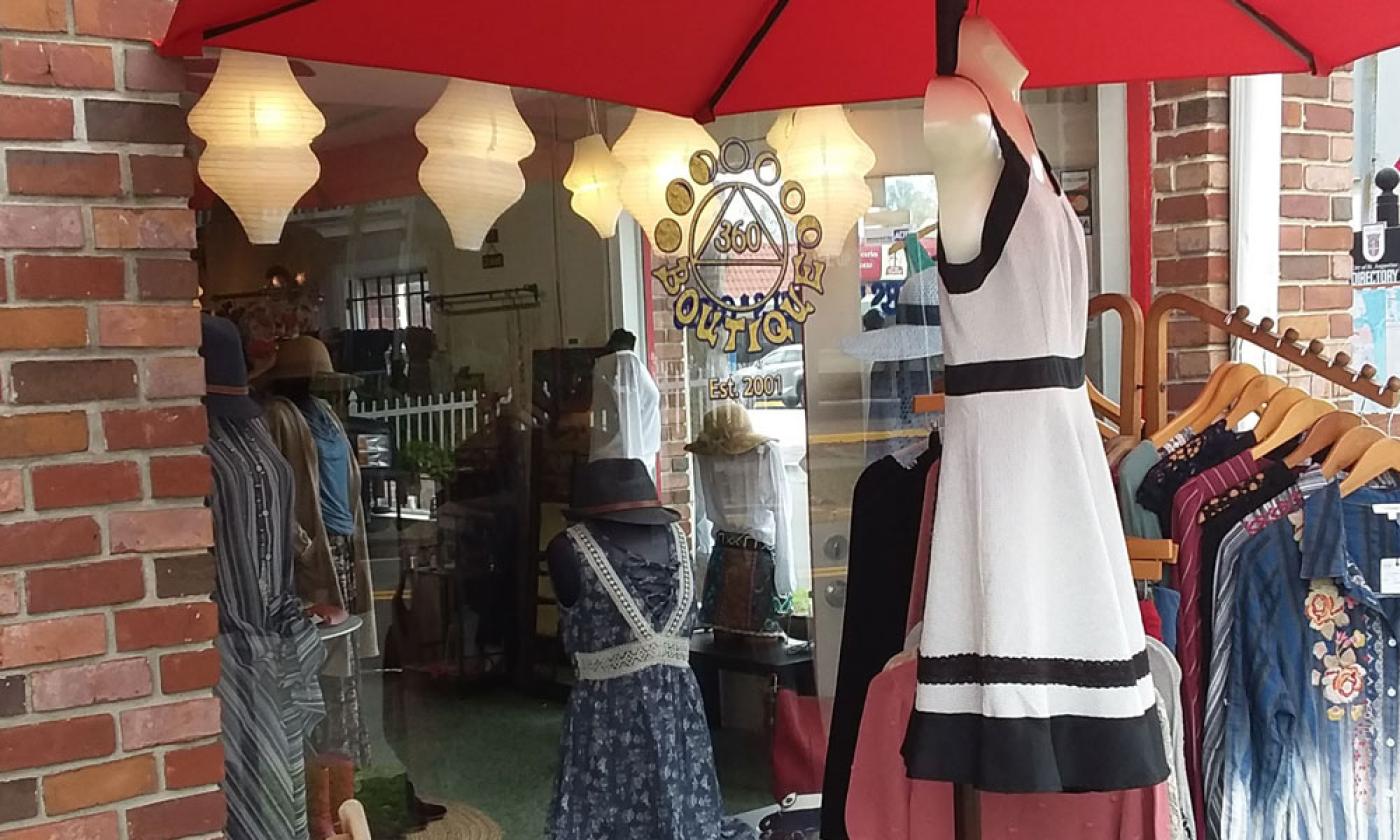 The front window with enticing fashions both outside and inside 360 Boutiqe in St. Augustine.