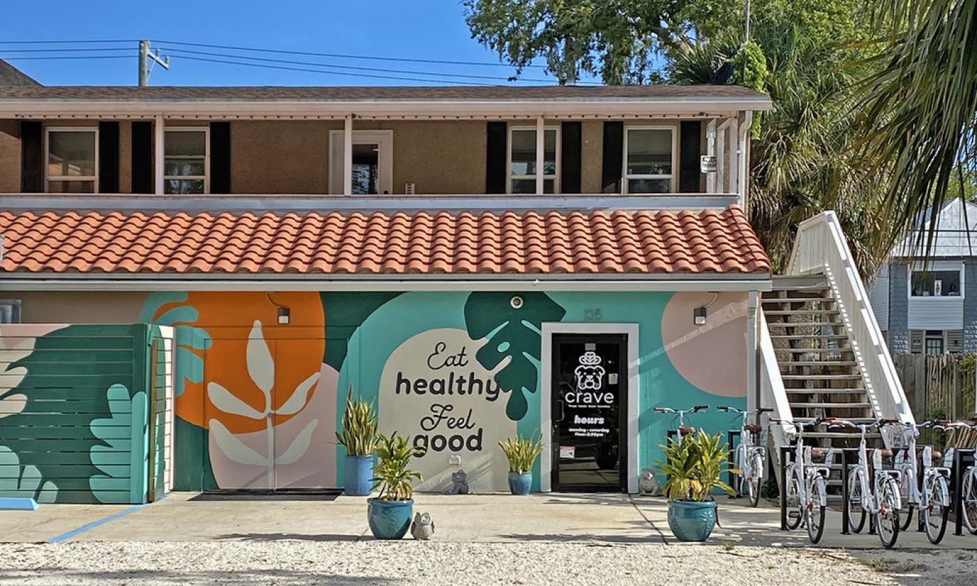 Crave's entrance, with parking and a bike rack, off La Quinta Place in St. Augustine.