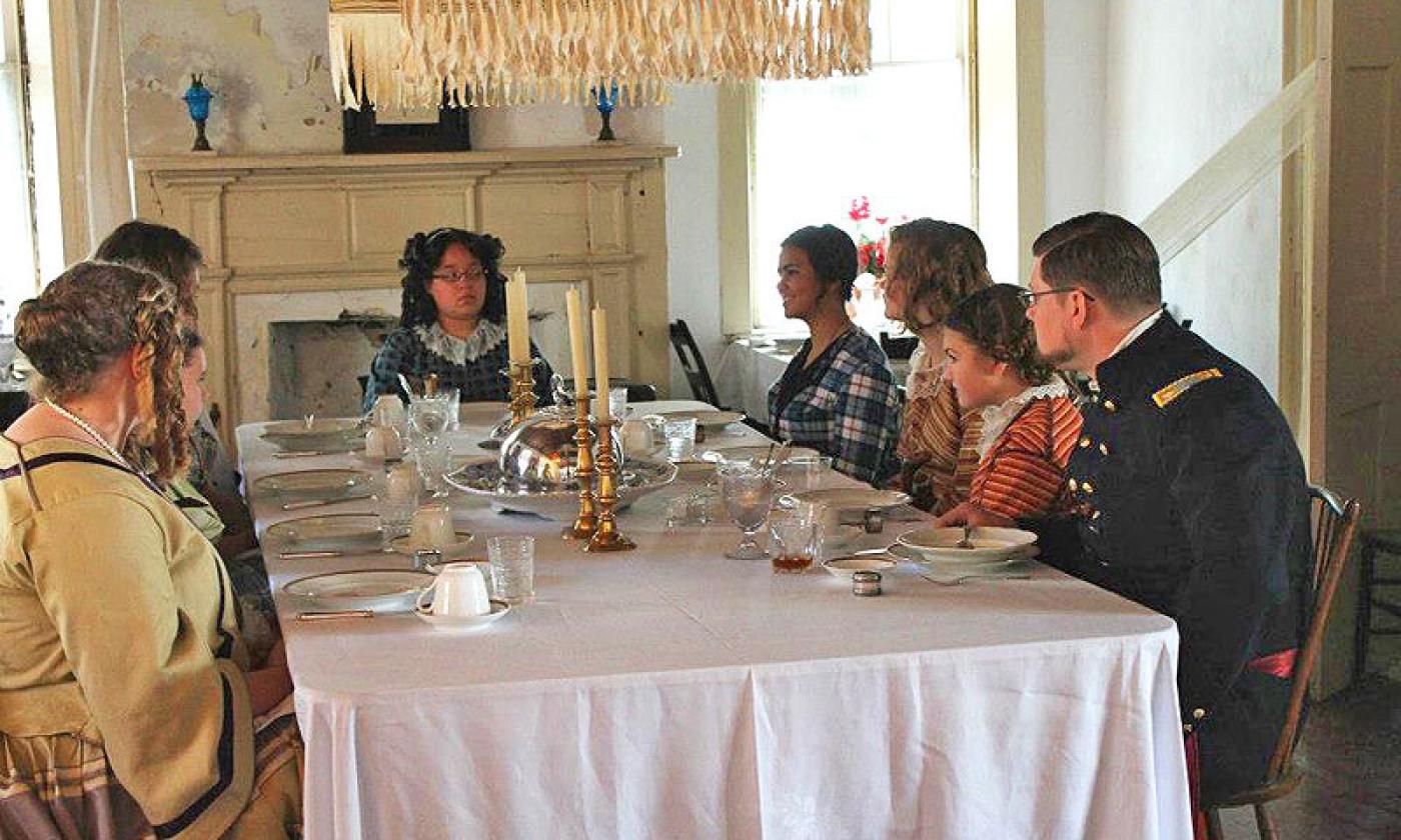 Re-enactment of a meal at the boarding house.