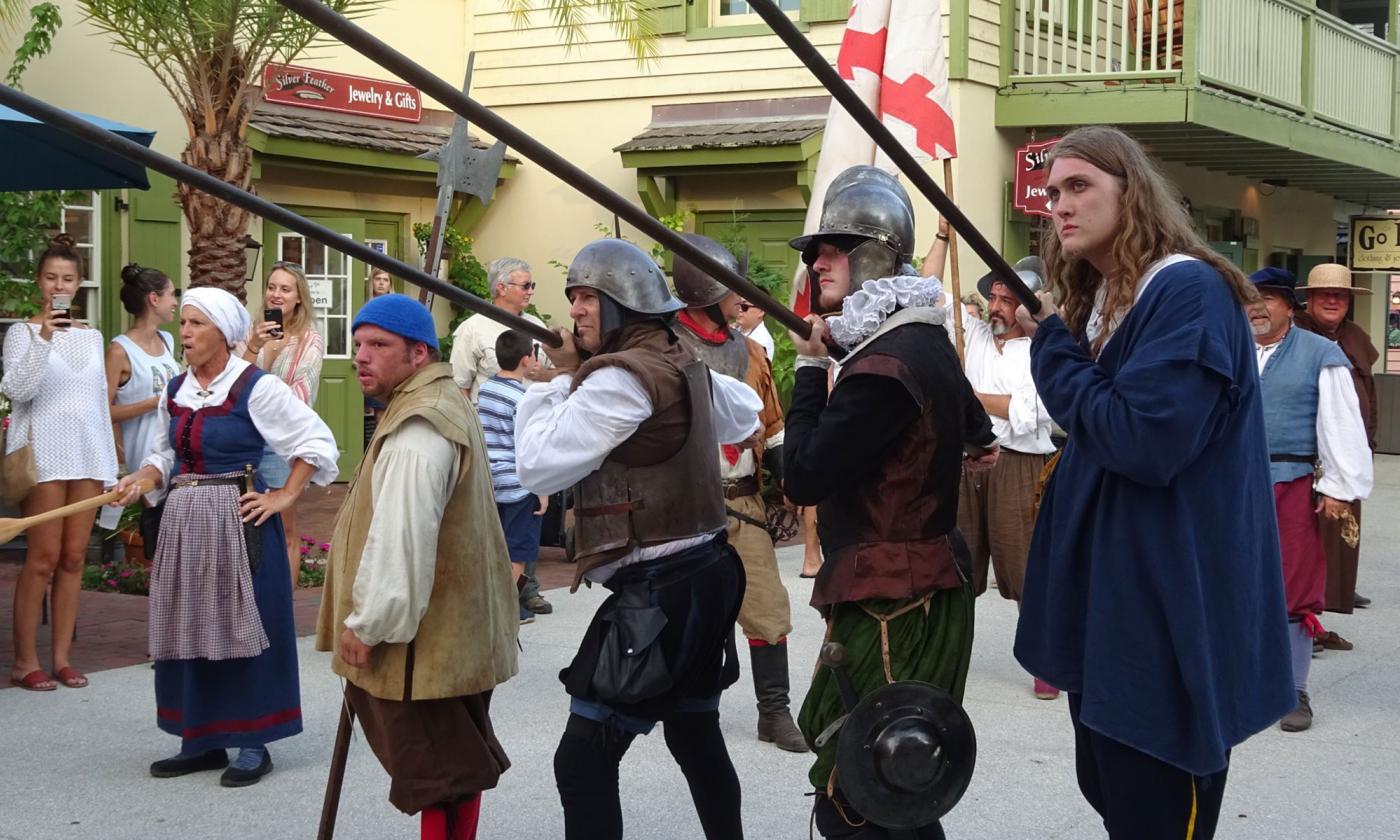 Reenactors participate in Drake's Raid on St. George Street in St. Augustine.