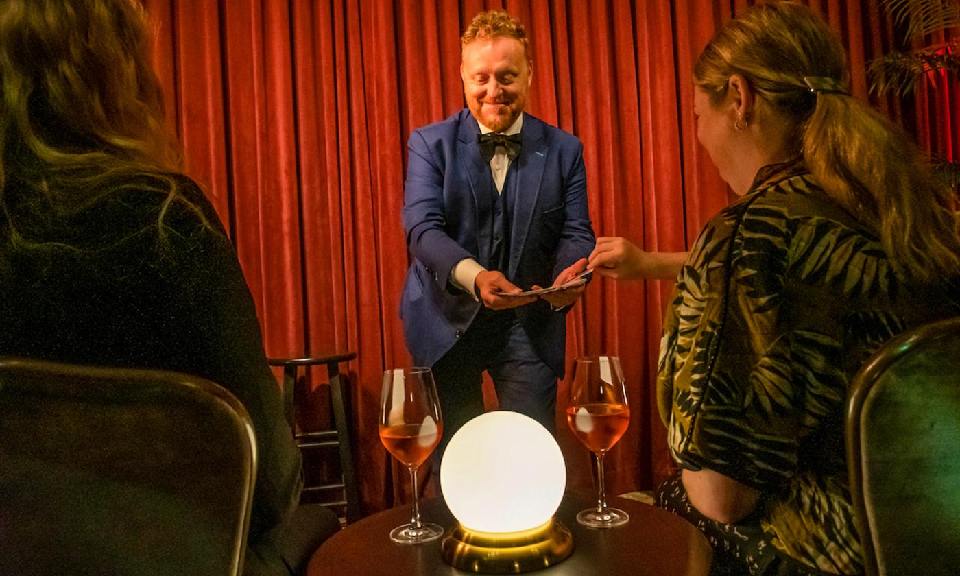 Bill Abbot interacting with members of the audience during his magic act at Magic Hideaway in St. Augustine.
