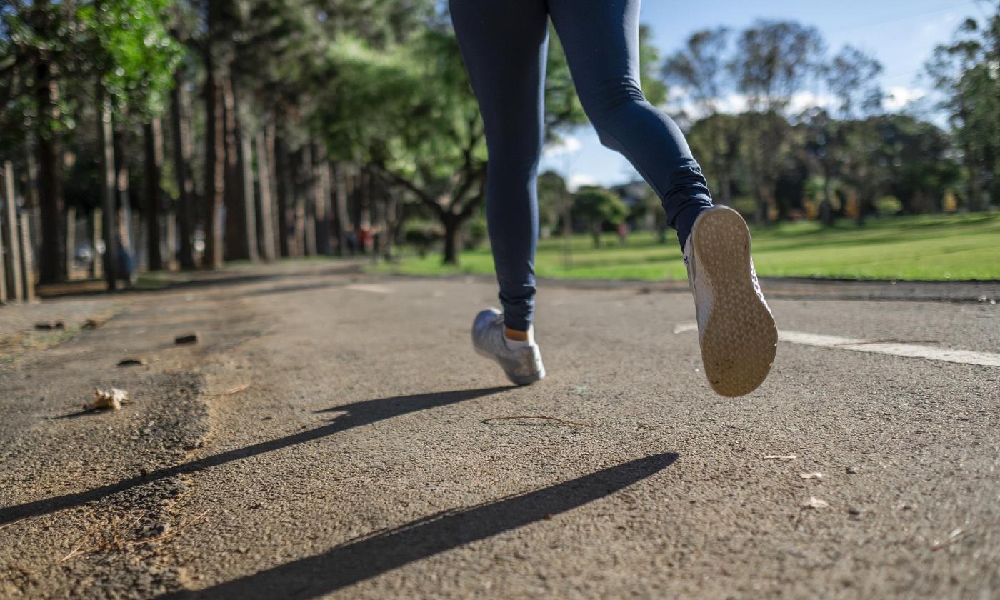 A runner travels on a scenic trail. 