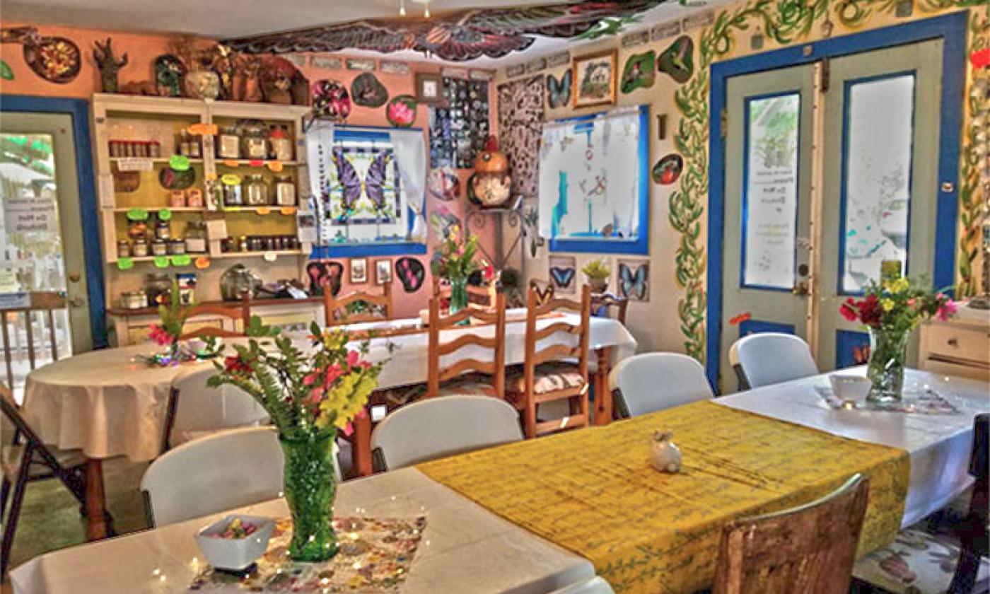The inside of Maggie's Herb shop with tables and chairs set up