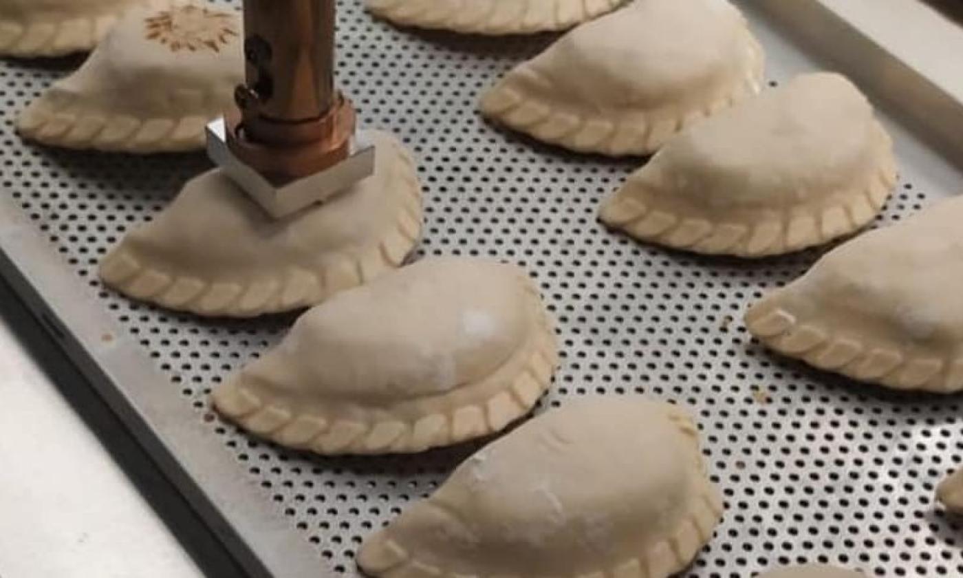 Empanadas being "branded" at Pampa St. Augustine at the Westgate Plaza in St. Augustine.