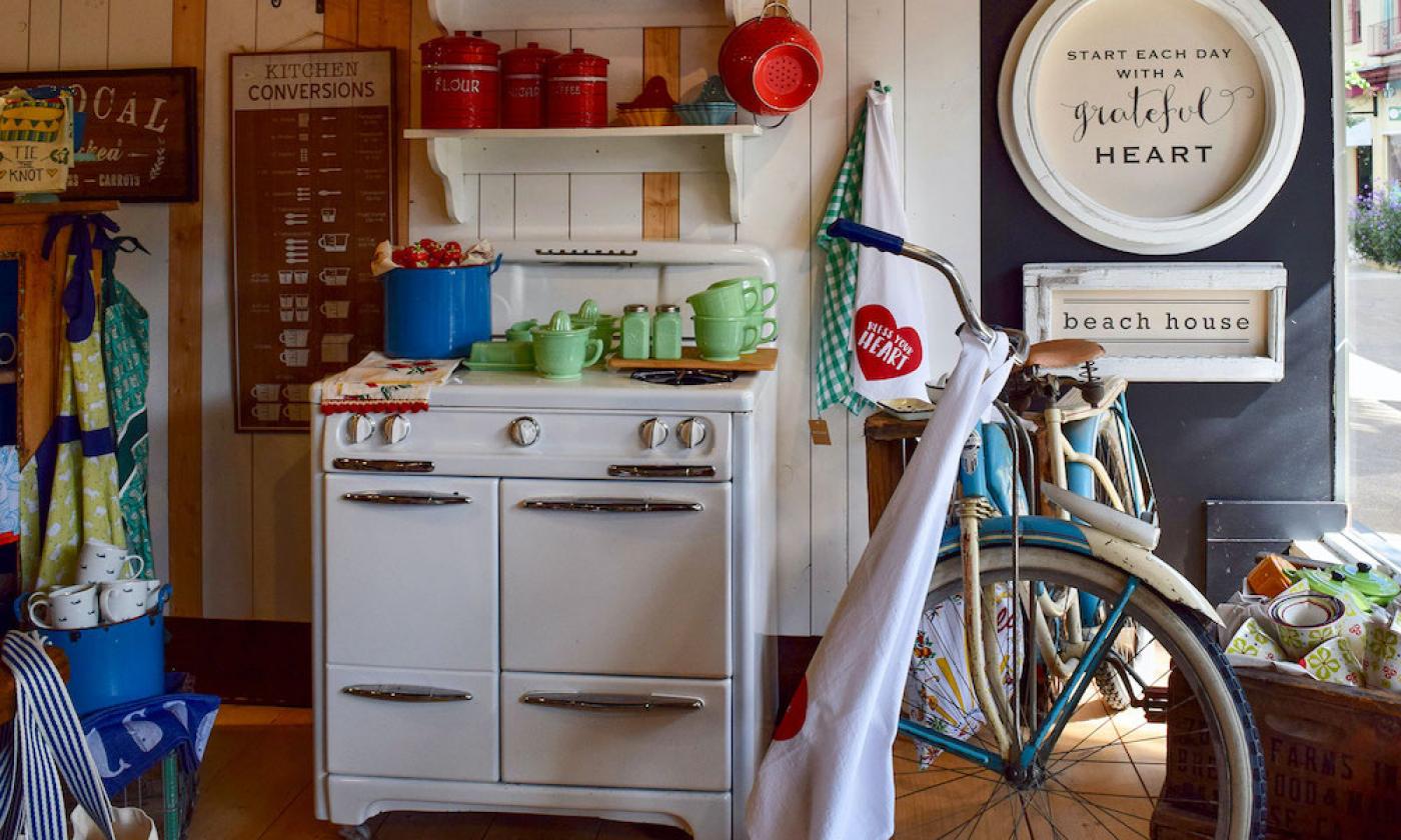 Kitchen supplies/decor and a bicycle in the store