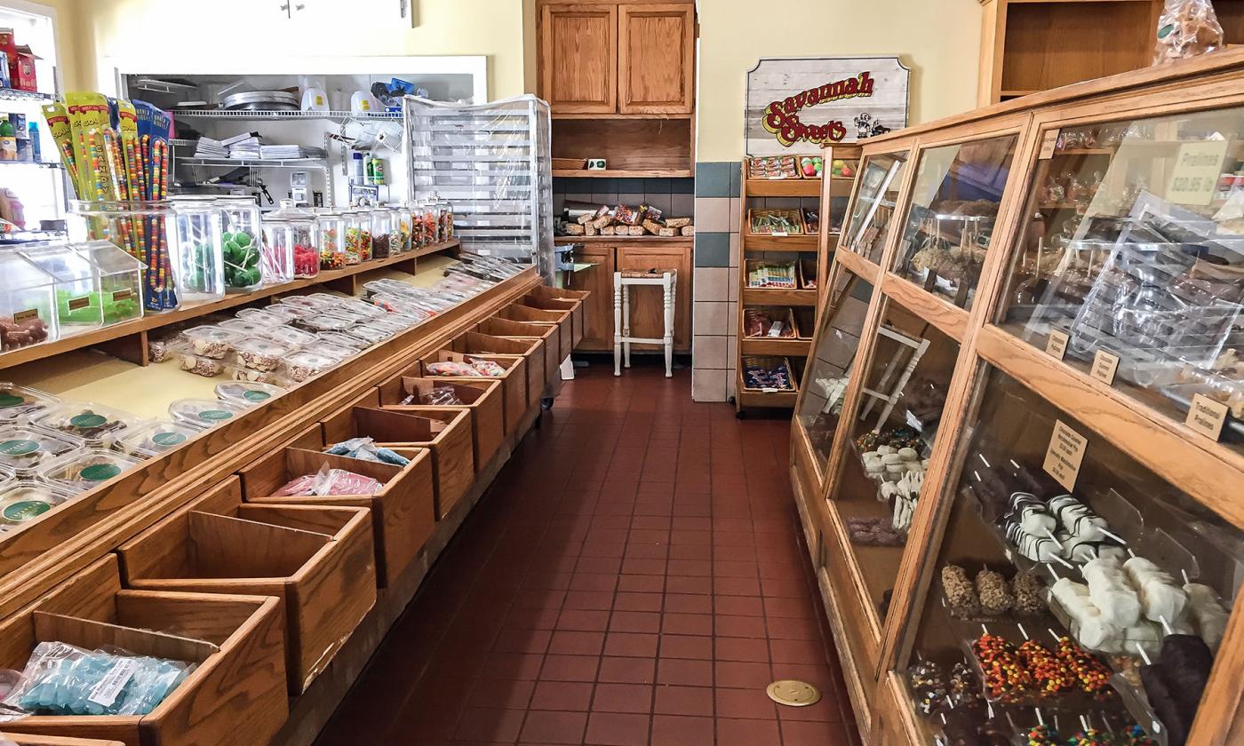 The glass displays of chocolates and candies inside the shop