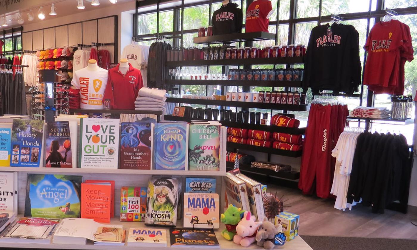 Books and Flagler clothing displayed inside the store