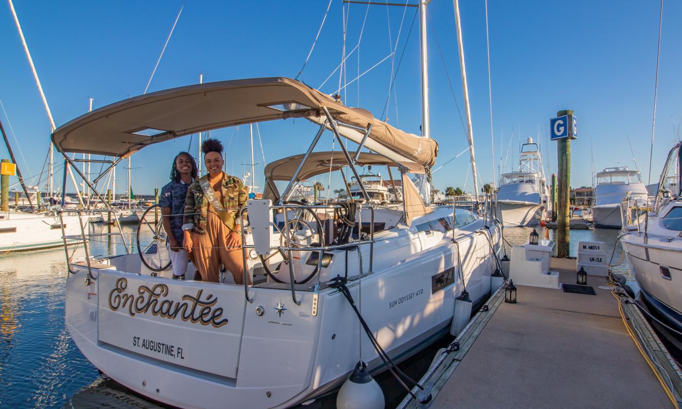 Two guests waiting on board to set sail with St. Augustine Sailing.