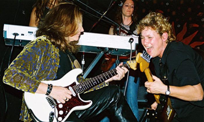 Vange Durst playing guitar with Robert Urban