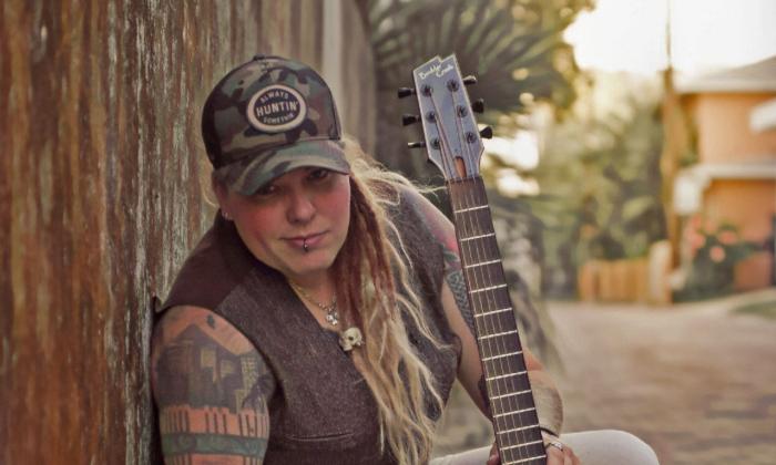 musician Heather Craig with guitar