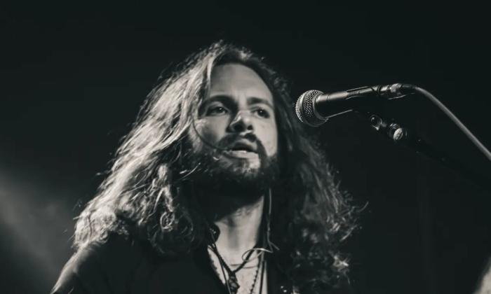 Musician Vern Daysel onstage at the microphone