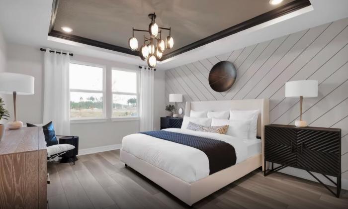 A home display of a modernized, furnished bedroom