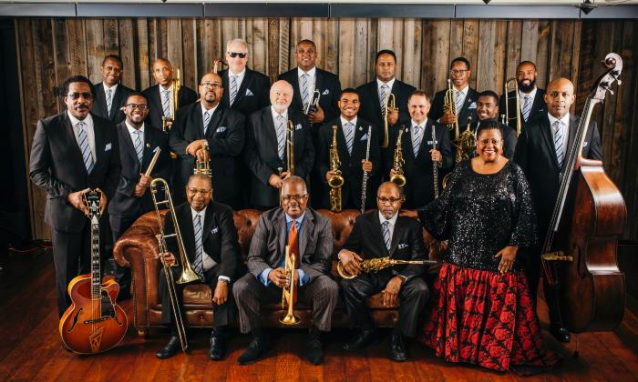 The 2024 Count Basie Orchestra, standing and seated with their instruments