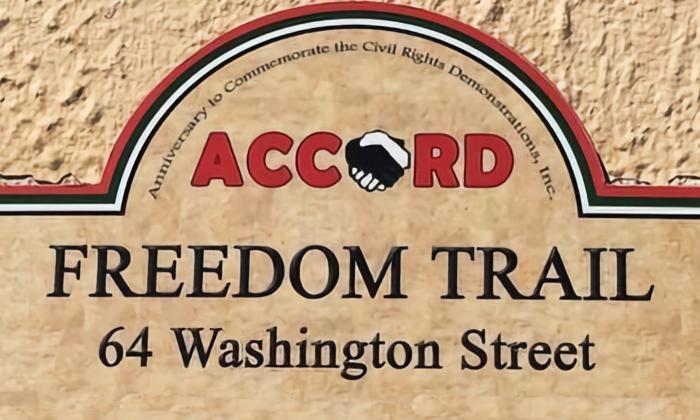 Close up of the ACCORD plaque at 64 Washington Street, showing logo and address.