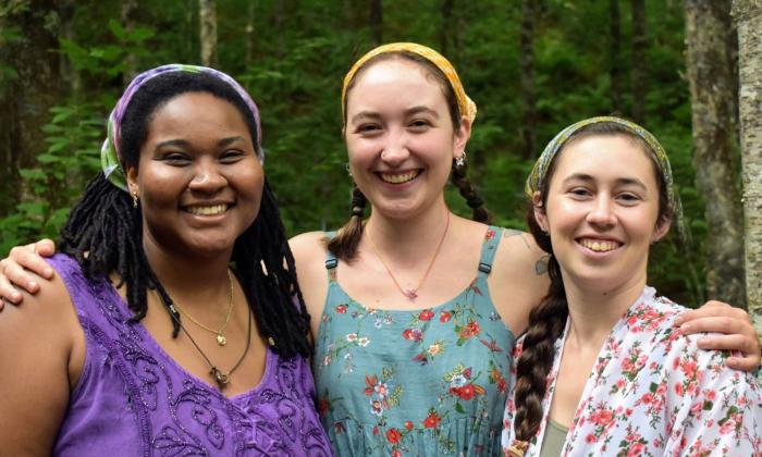 The Little Mercies band of three women standing outside, smiling.