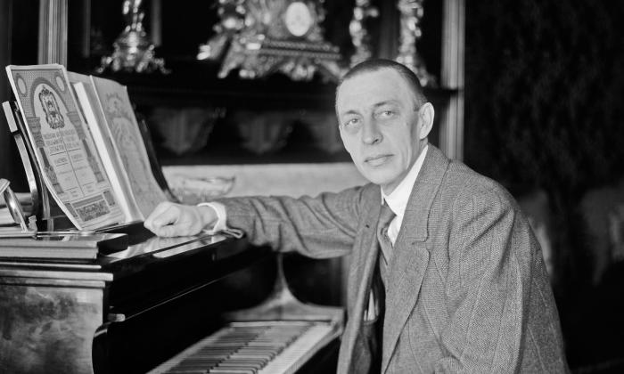 The composer and pianist Sergei Rachmaninoff seated at the piano