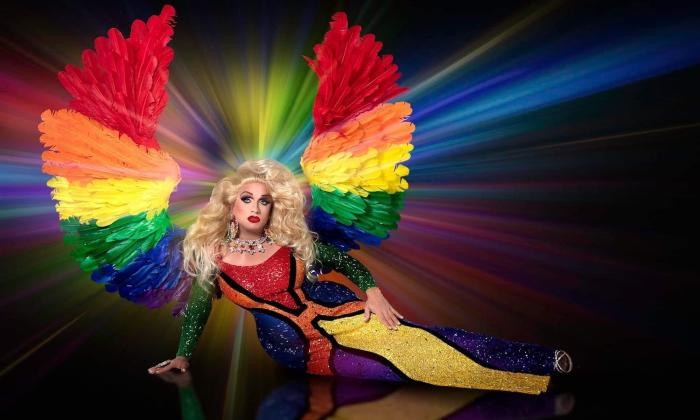 A drag queen in a rainbow outfit