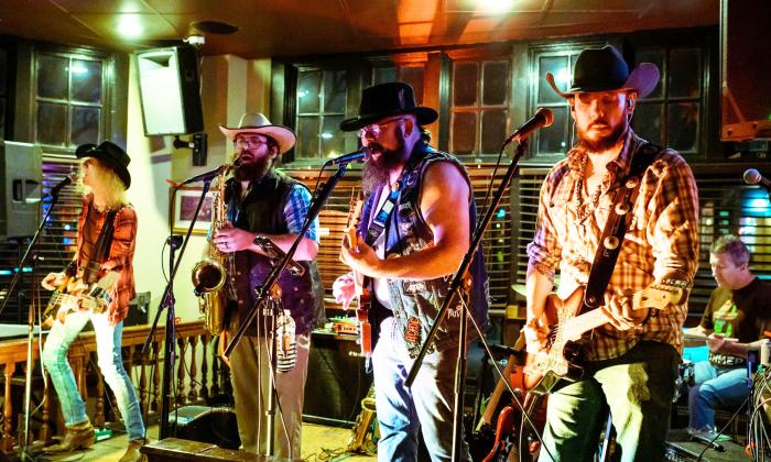 the band Los Swamp Monsters on stage