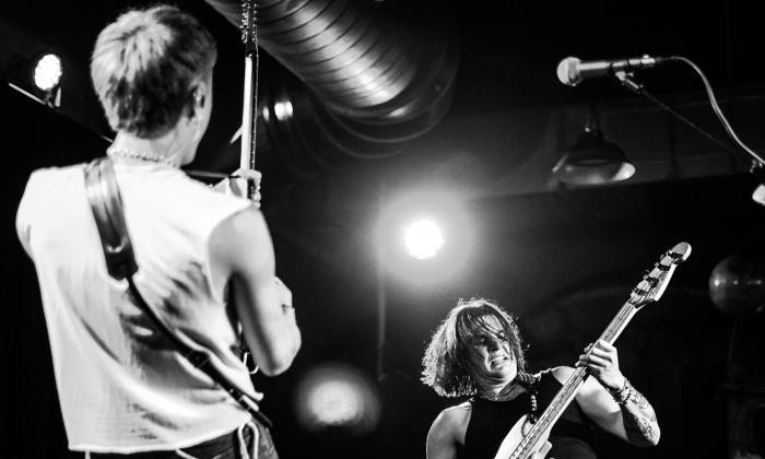 The duo MAK on stage in black and white with spotlights