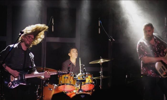 Ancient Sun onstage playing at a gig