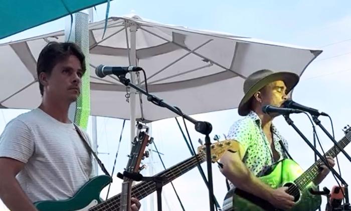 Ragga Surf Music band performing at a marina
