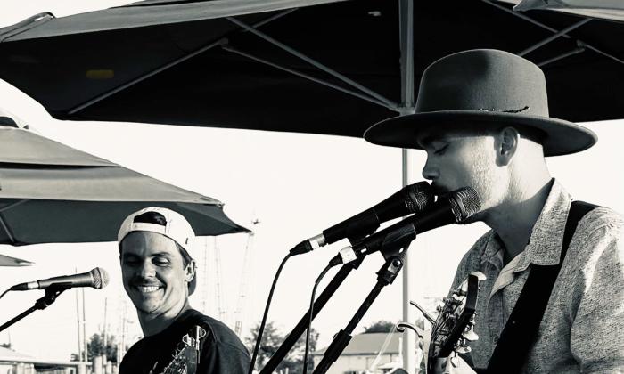 Ragga Surf Music playing onstage, outdoors