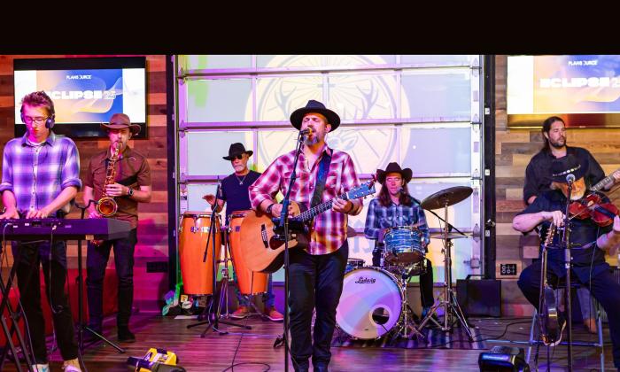 The band Slickwood performing onstage